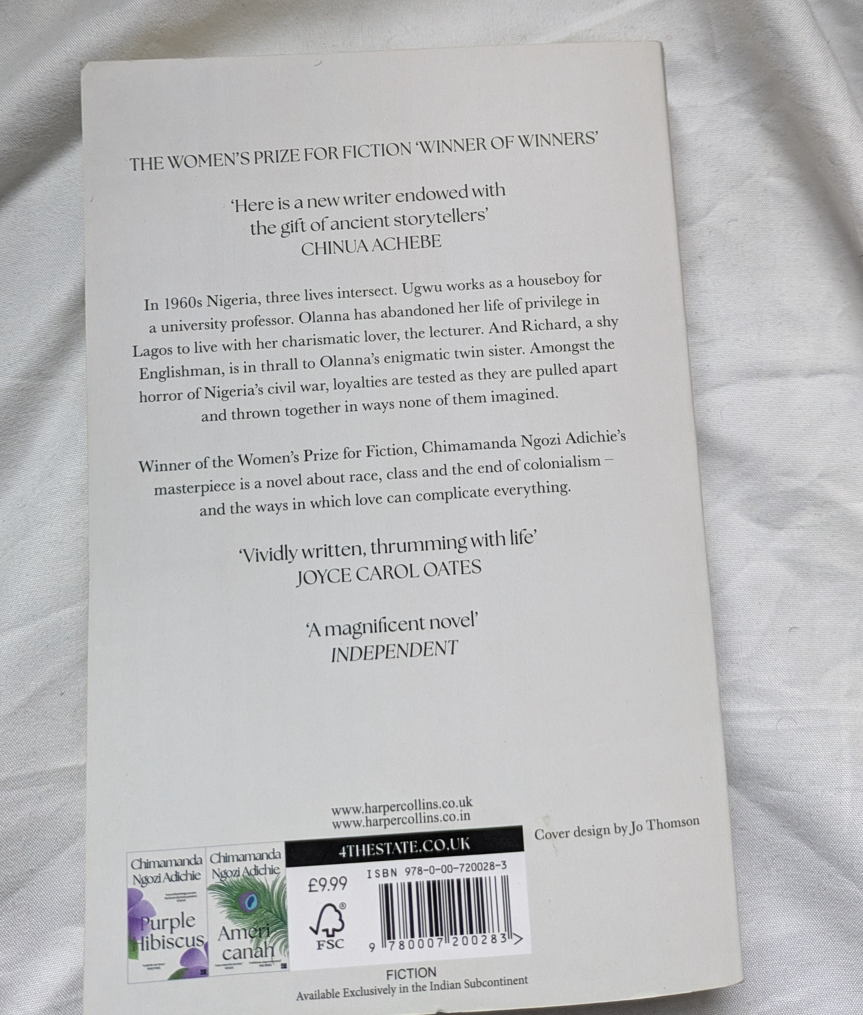 Back cover of Half of a Yellow Sun with blurb and praise from critics Back cover of the book half of a yellow sun