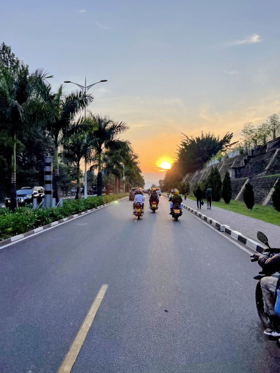Kigali road at sunset with bikes enhanced