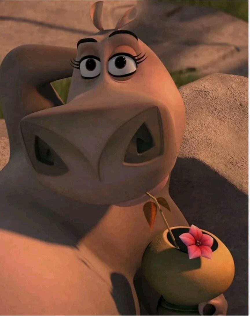 Gloria from Madagascar takes a sip out of a coconut Moto Moto scene