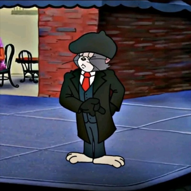 Tom dressed as a gentleman in peaky blinders style