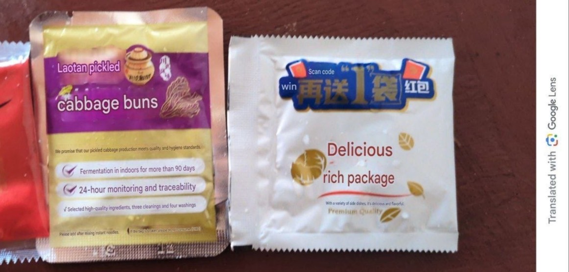 3 Translated Chinese noodles smaller inner packet on display showing translated texttext 3 Translated Chinese noodles smaller inner packet on display showing text: lao tan pickled cabbage buns, and