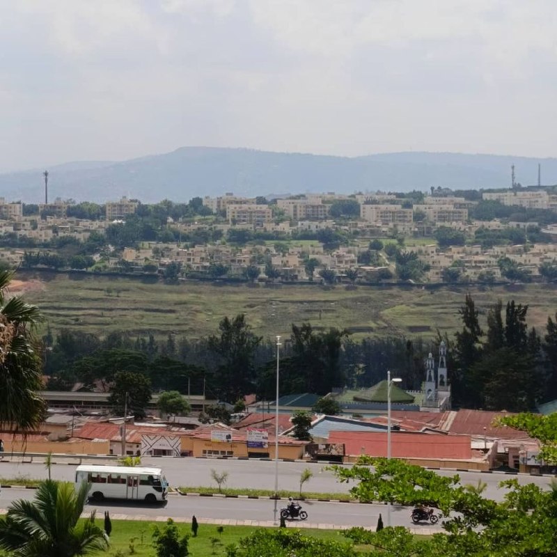 Road in Rwanda With Vision City in the Background